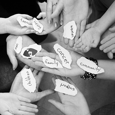 hands together showing support for cancer